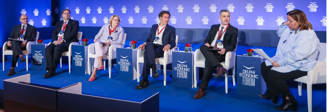 a group of people sitting on a stage