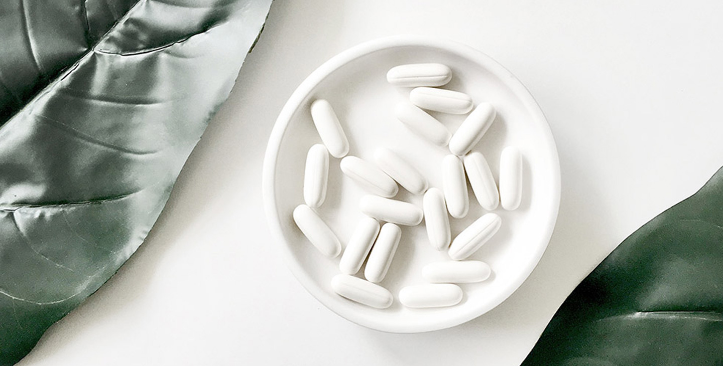 a bowl of white pills