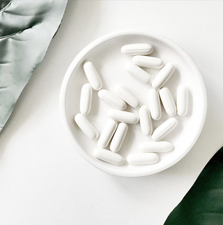 a bowl of white pills