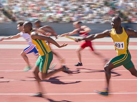 a group of people running on a track